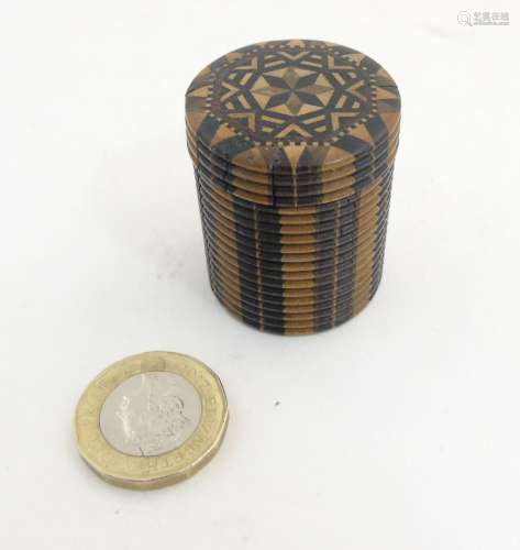 A Tunbridge 19thC stick ware parquetry games counter box of cylindrical form with screw lid.