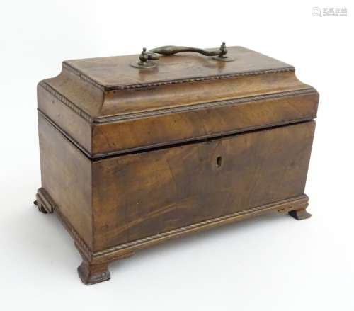 An 18thC mahogany tea caddy on ogee feet and opening to reveal 3 tin containers within.