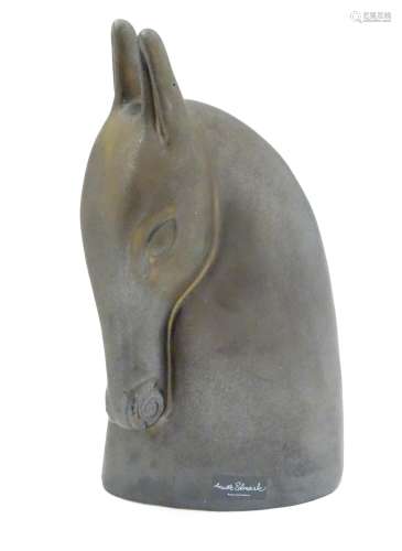 Anette Edmark: A bronzed terracotta stylised horsehead.