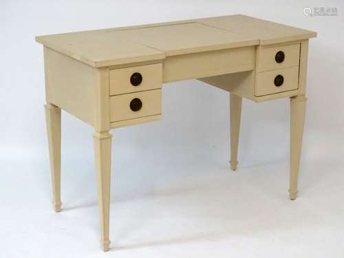 An early / mid 20thC ‘John Widdicomb’ dressing table with hinged lid lifting to reveal space within,