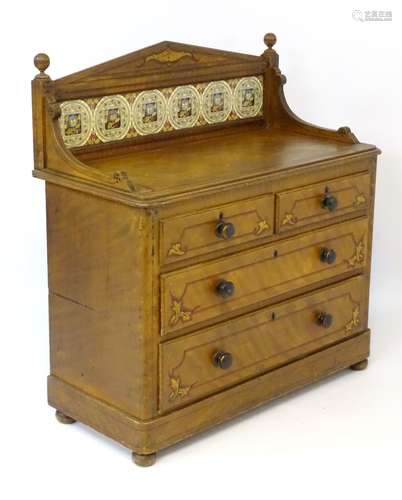 A late 19thC / early 20thC gallery backed chest of drawers / dressing chest with a pointed pediment