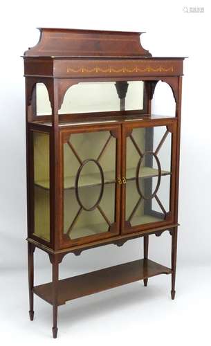 An Edwardian mahogany China cabinet / display cabinet with moulded cornice and marquetry inlay to