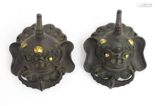 A pair of 18thC / 19thC bronze and gilded door knockers formed as mythical animals.