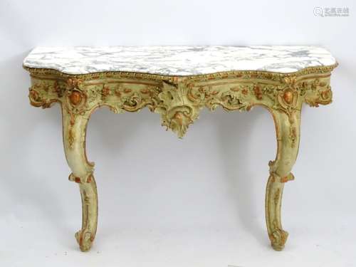 A 19thC marble topped console table with painted and decoratively moulded base,