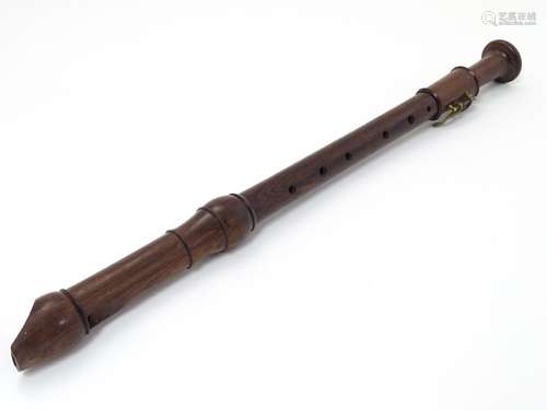 Musical Instruments: A Victorian tenor recorder flute, of rosewood construction in three sections,