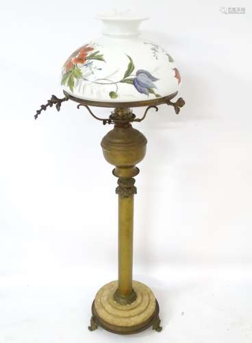 Victorian brass oil lamp : a floor standing twin burner Duplex oil lamp with hand painted shade