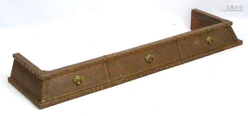 Arts and Crafts : a copper hammered fire fender with three applied brass sections ,