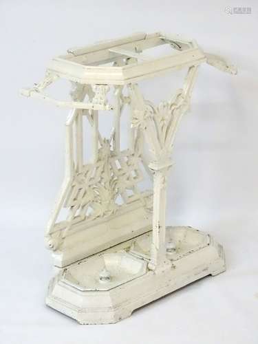 A Victorian white painted cast iron stick stand with Y front frame,