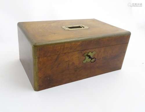 A Hong Kong mahogany veneered cedar wood box, brass banded corners, military style handle.