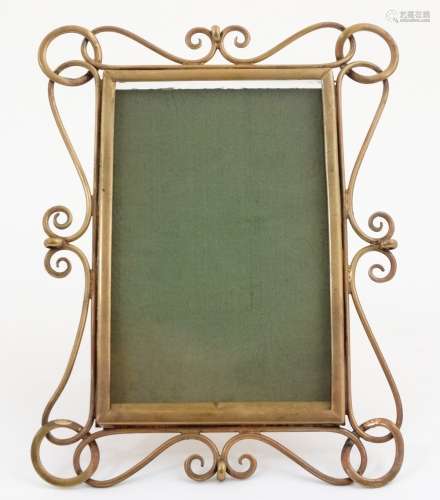 A late Victorian brass easel back photograph frame with decorative wirework border to frame,