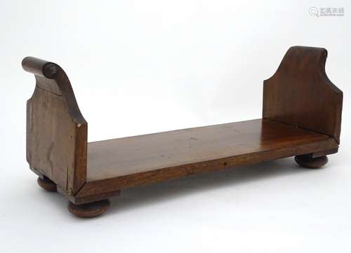 A rare Regency Mahogany desk book stand / book trough with of scrolled ends and squat bun feet ,