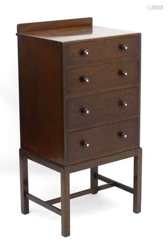 An Art Deco mahogany four drawer chest with graduated oak lined drawers,