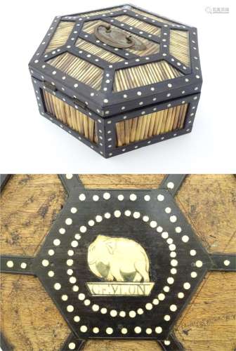 A Sri Lankan / Ceylon hexagonal quill work box with ebony and bone detail and opening to reveal the