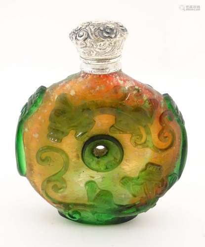 An Oriental glass vinaigrette bottle with white metal top.