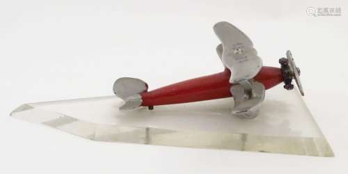 A desktop model Biplane, of metal construction with red and silver painted finish,