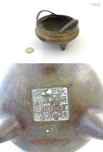 A Ming? Dynasty three footed Chinese bronze censor, unusually marked under.