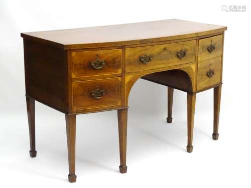An early / mid 19thC mahogany bow fronted sideboard having long central drawer flanked by two short
