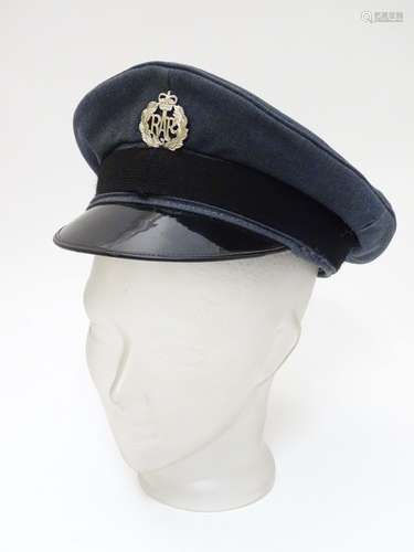 Militaria: A mid 20thC Royal Air Force ensign peaked cap with applied RAF badge,