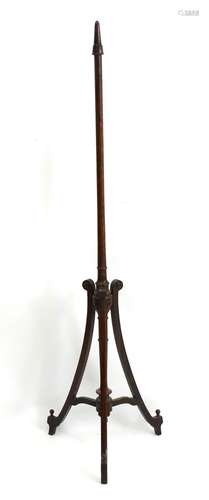 A late 19thC rosewood hat stand with turned tapering stem raised on a tripod base with applied