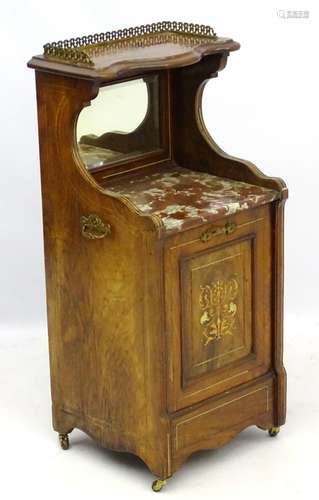 A Victorian rosewood purdonium with brass gallery above serpentine shaped top tier,