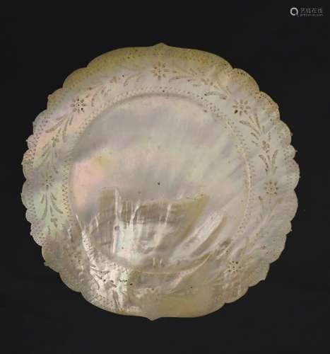 A 19thC carved mother of pearl circular plate / dish with wriggle work decoration.