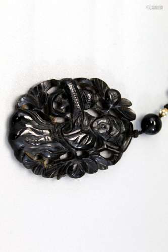 Chinese carved stone pendant.