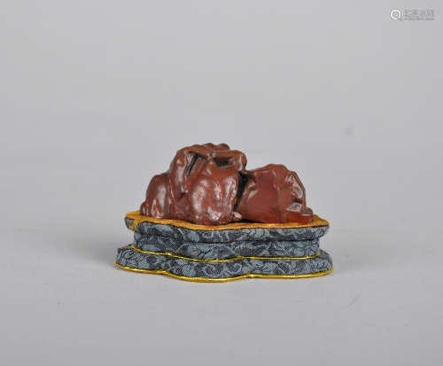 Chinese carved agate boulder on stand.