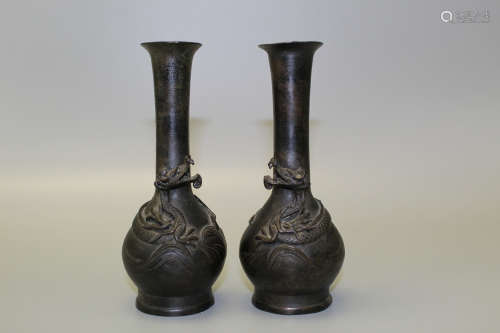 A pair of Chinese bronze dragon vases
