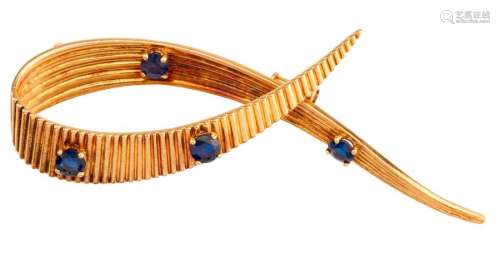 Signed yellow gold brooch decorated with sapphires...