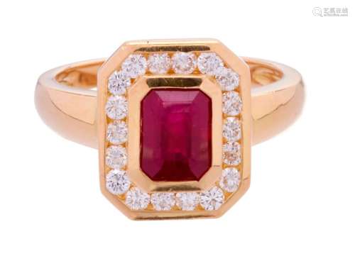 Yellow gold ring set with a rectangular ruby surro...