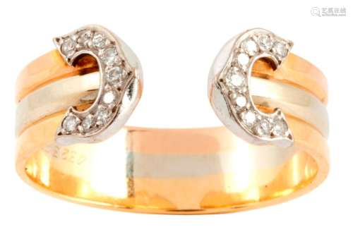 Three tone gold ring set with diamonds on each end...