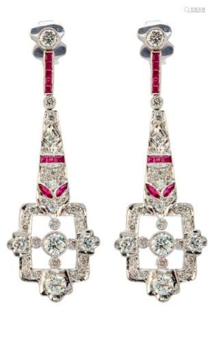 White gold chandelier earrings set with nice quali...