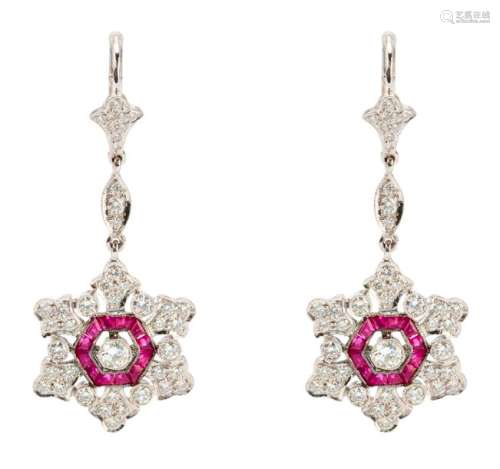 Snowflakes shaped earrings set with brilliant cut ...