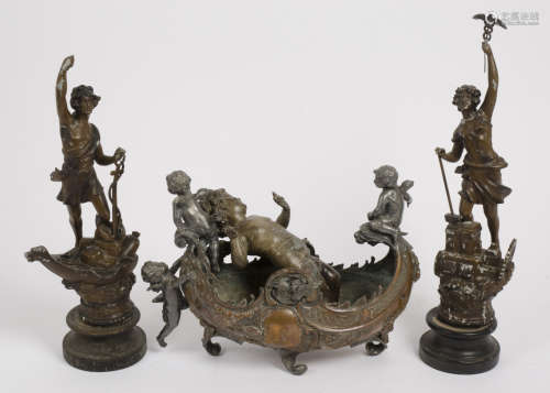 A 19th Century copper centrepiece, boat form, mounted with spelter cherubs, 38 cm long x 29 cm high.