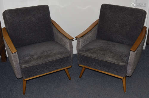 A pair of Scandinavian beech and upholstered easy chairs c. 1954, varnished arms with solid grey