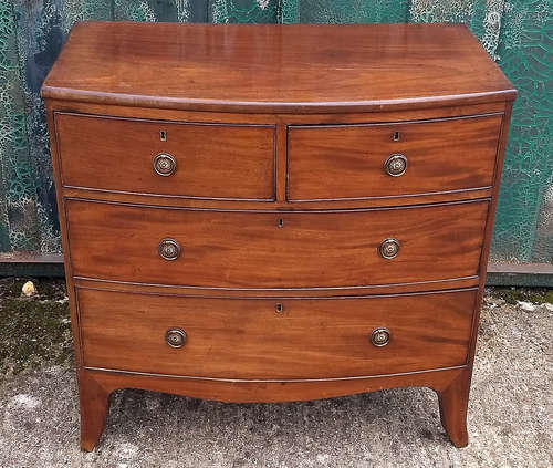 A 19th Century mahogany bow-front chest-of-drawers, two short over two long cockbeaded drawers, 89