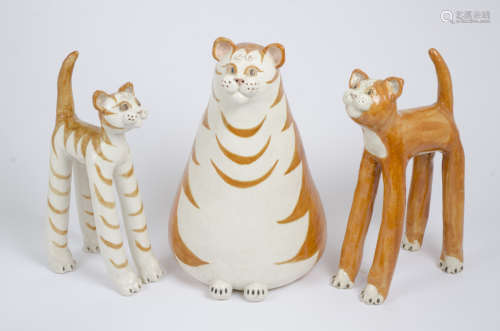 Three ginger cat figures, a seated fat feline, 42 cm high, together with two smaller standing