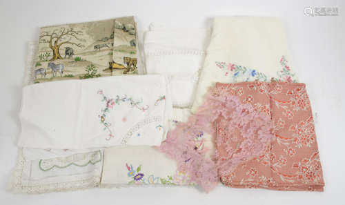 A large collection of textiles, tablecloths, place mats, doilies, handkerchiefs and more, some