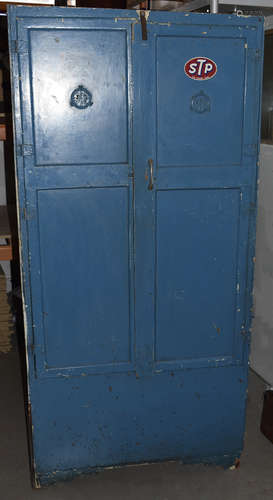 A mid 20th Century blue painted metal and wood workshop cabinet, panelled doors one with interior