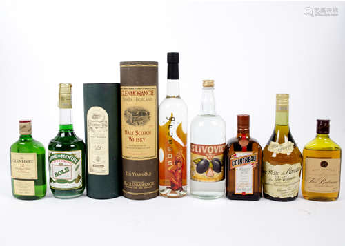 A collection of 27 bottles of miscellaneous spirits and liqueurs, including cased single malt