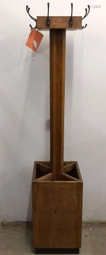 A 1930s Arts and Crafts oak hall stand, square top with coat hooks (two hooks removed), cruciform