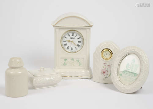 A group of Belleek, including an 8th period mantle clock, arched pediment, shamrock decoration, 25