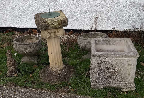 A group of garden stoneware, including a sundial, circular dial on square top, ionic column,