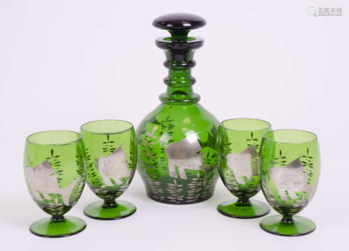A Bohemian green glass decanter and stopper, decorated with a silver overlay of fish and