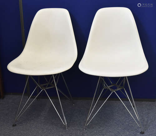 A set of six Charles and Ray Eames Vitra made plastic single chairs, on Eiffel Tower bases, some