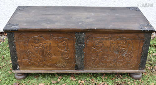 An 18th Century Scandinavian carved oak and metal bound coffer, decorated with carved Norse