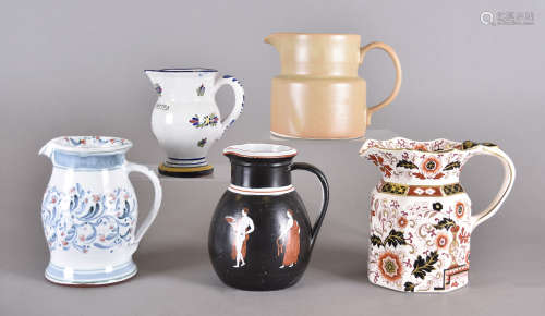 Five ceramic jugs of differing designs and patterns, including a Mason's 'Franklin' pattern example,