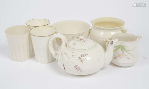 A group of Belleek porcelain, including three 1st period beakers and bowl, a teapot, milk jug and