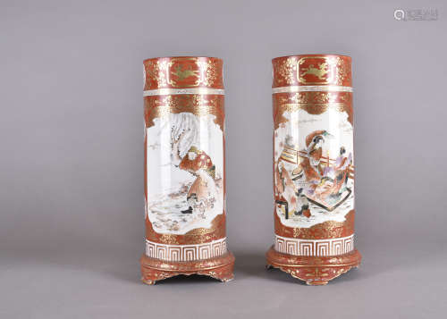 A pair of Kutani Meiji period Japanese porcelain sleeve vases, decorated with dancing females within