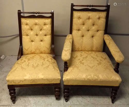 A pair of late 19th Century mahogany gentleman and lady's button backed chairs, yellow floral